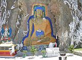 Tibet Lhasa 01 03 Buddha Rock Painting Just Outside Lhasa On arrival at Lhasas Gonggar airport, we had to pass through a special security screen which actually took our temperature. After clearing immigration and customs we met our guide Jigme and our Landcruiser driver Panchoul. We stopped just 11km from Lhasa to admire a large and colourful Buddha carved into the base of a cliff. This used to be behind a small lake, but theyve filled in the part next to the statue with gravel, so now you can walk directly there.